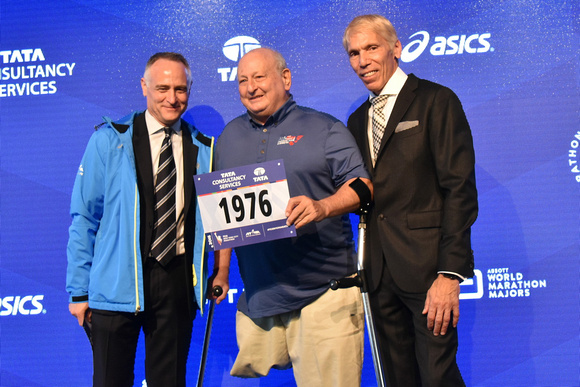 NYRR President and CEO Michael Capiraso and NYRR President of Events and Race Director of the TCS New York City Marathon Peter Ciaccia welcome first known amputee marathon finisher and 2016 TCS New Yo