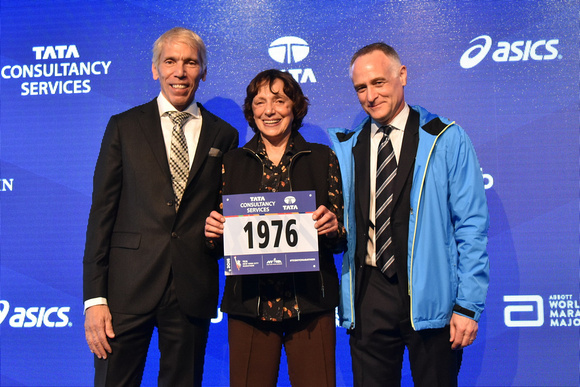 NYRR President and CEO Michael Capiraso and NYRR President of Events and Race Director of the TCS New York City Marathon Peter Ciaccia welcome 1976 top-ten female finisher Nina Kuscsik at the Faces of